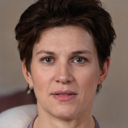 Joyful white adult female with short  brown hair and brown eyes