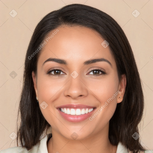 Joyful latino young-adult female with medium  brown hair and brown eyes