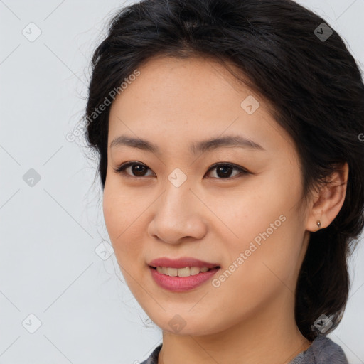 Joyful asian young-adult female with long  brown hair and brown eyes