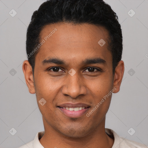 Joyful latino young-adult male with short  black hair and brown eyes