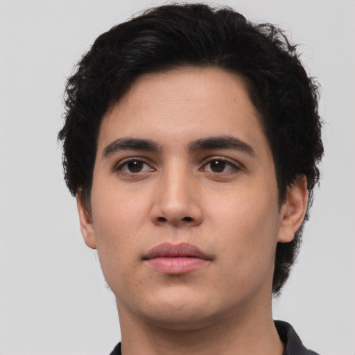Neutral white young-adult male with short  black hair and brown eyes