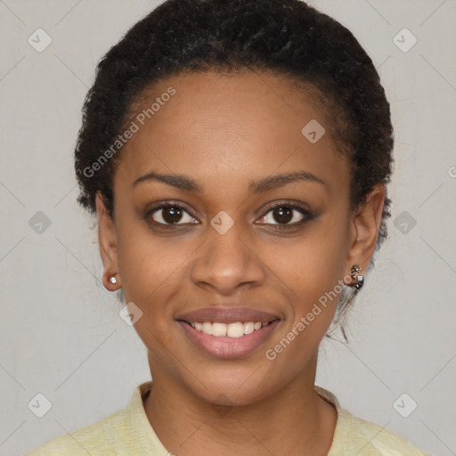 Joyful black young-adult female with short  brown hair and brown eyes