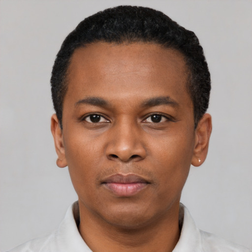 Neutral black young-adult male with short  black hair and brown eyes
