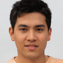 Joyful asian young-adult male with short  brown hair and brown eyes