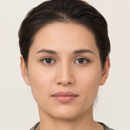 Neutral white young-adult female with short  brown hair and brown eyes