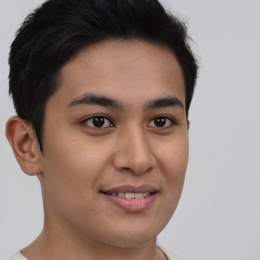 Joyful asian young-adult male with short  brown hair and brown eyes