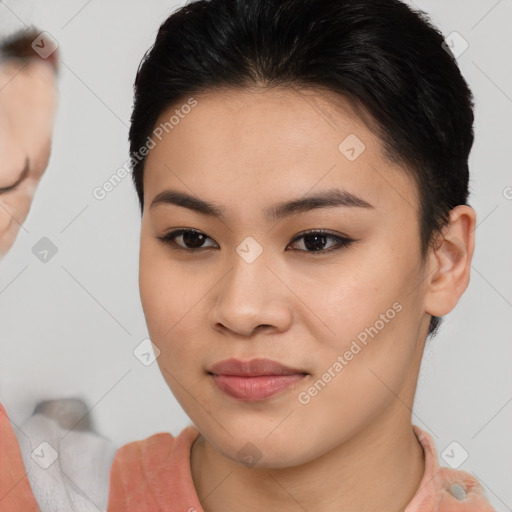 Joyful asian young-adult female with short  brown hair and brown eyes