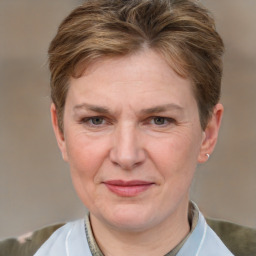 Joyful white adult female with short  brown hair and grey eyes