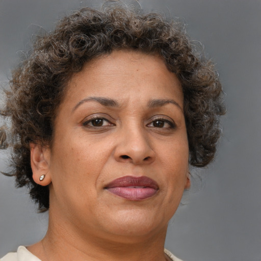 Joyful white adult female with short  brown hair and brown eyes