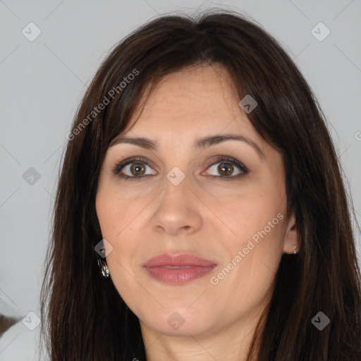 Joyful white adult female with long  brown hair and brown eyes