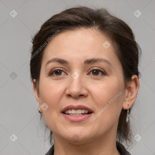 Joyful white adult female with medium  brown hair and grey eyes