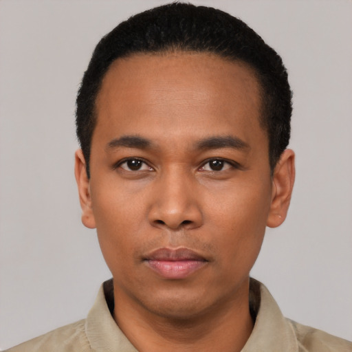 Neutral latino young-adult male with short  black hair and brown eyes