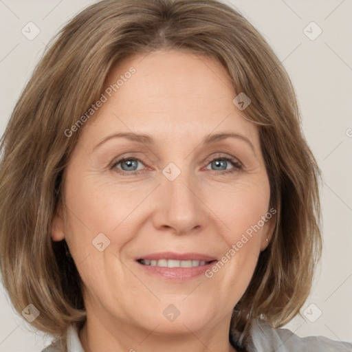 Joyful white adult female with medium  brown hair and grey eyes