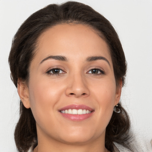 Joyful white young-adult female with medium  brown hair and brown eyes