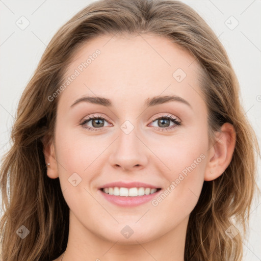 Joyful white young-adult female with long  brown hair and blue eyes