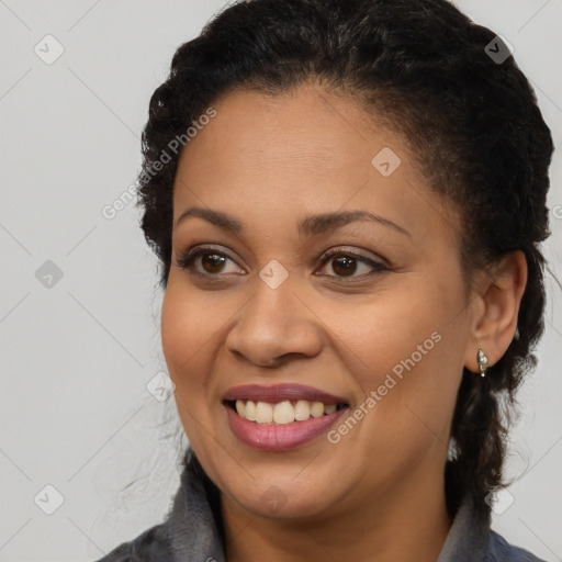 Joyful latino young-adult female with long  brown hair and brown eyes