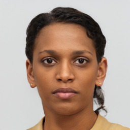 Neutral black young-adult female with short  brown hair and brown eyes