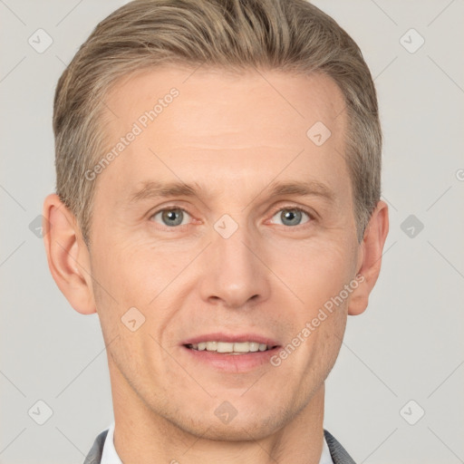 Joyful white adult male with short  brown hair and grey eyes