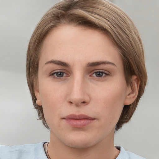 Neutral white young-adult female with short  brown hair and grey eyes