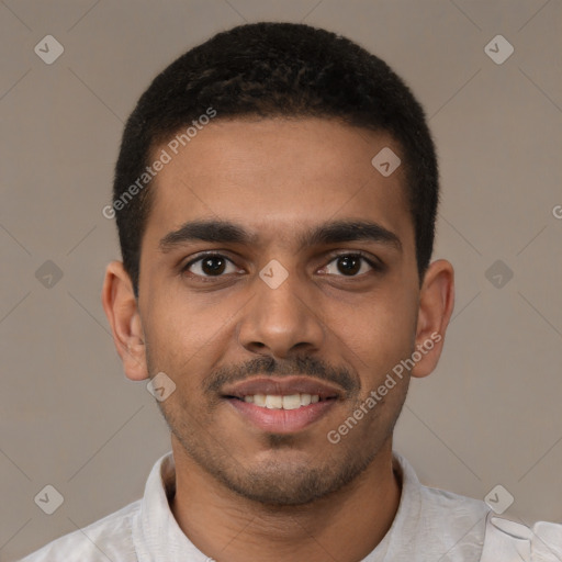 Joyful latino young-adult male with short  brown hair and brown eyes