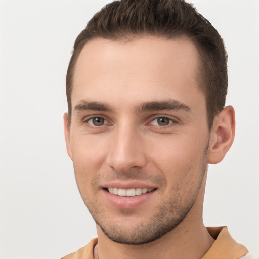 Joyful white young-adult male with short  brown hair and brown eyes