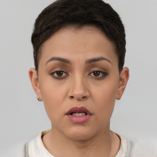 Joyful white young-adult female with short  brown hair and brown eyes