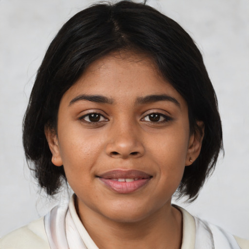 Joyful latino young-adult female with medium  brown hair and brown eyes