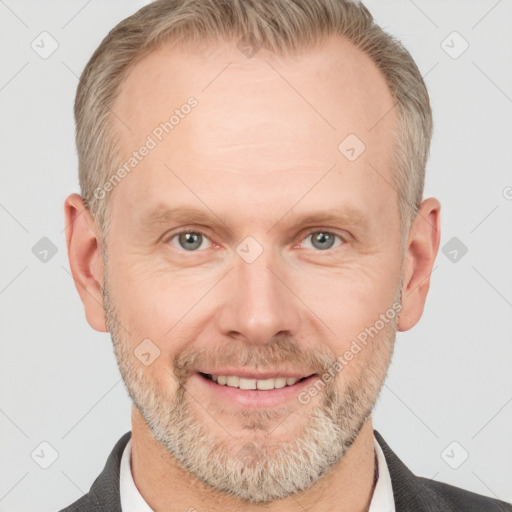 Joyful white adult male with short  brown hair and grey eyes