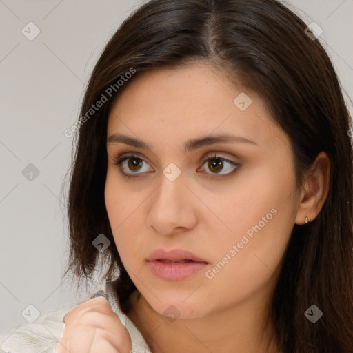 Neutral white young-adult female with long  brown hair and brown eyes