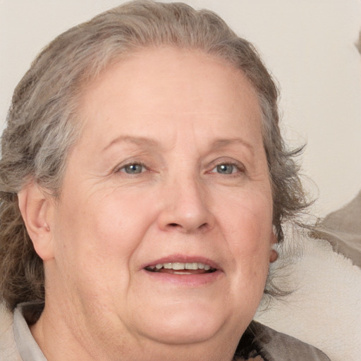 Joyful white middle-aged female with medium  brown hair and brown eyes