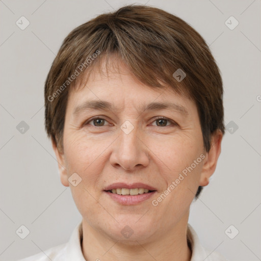 Joyful white adult female with short  brown hair and brown eyes