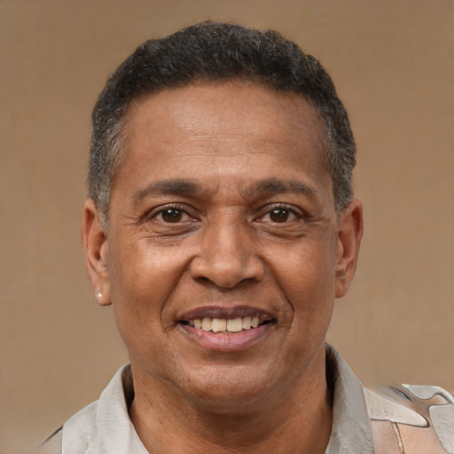 Joyful latino adult male with short  brown hair and brown eyes