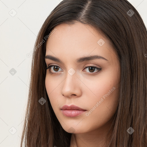 Neutral white young-adult female with long  brown hair and brown eyes