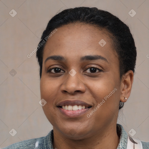 Joyful latino young-adult female with short  black hair and brown eyes