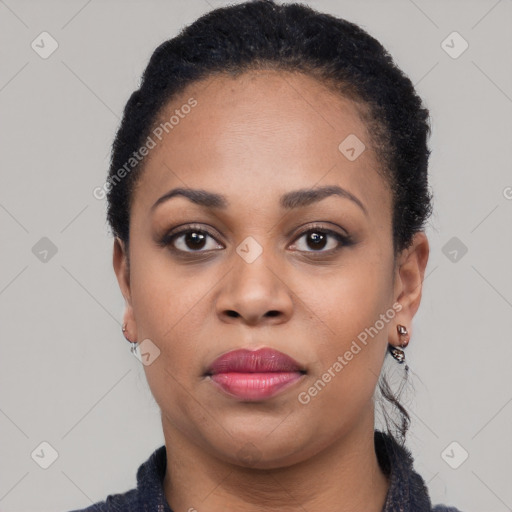 Joyful black young-adult female with short  black hair and brown eyes