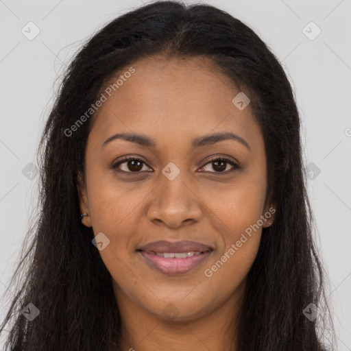 Joyful black young-adult female with long  brown hair and brown eyes