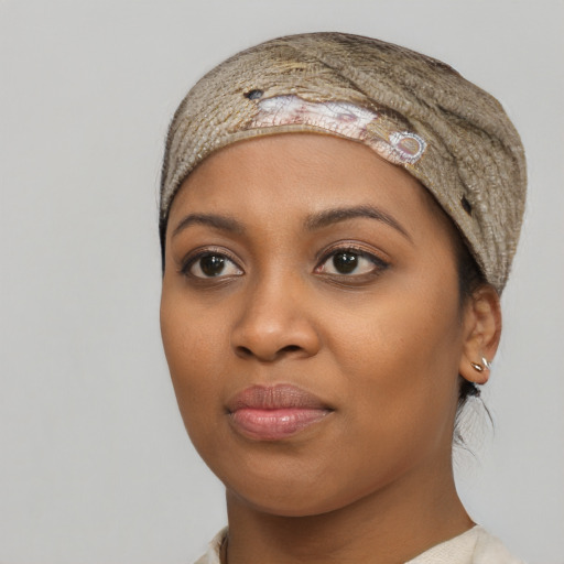 Neutral black young-adult female with medium  black hair and brown eyes