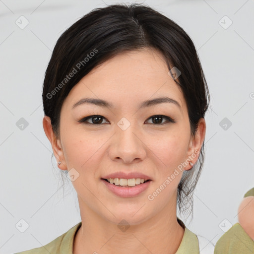 Joyful asian young-adult female with medium  black hair and brown eyes