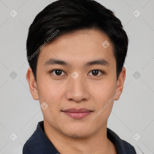 Joyful asian young-adult male with short  black hair and brown eyes