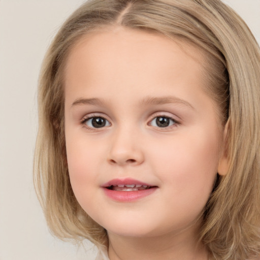 Joyful white child female with medium  brown hair and brown eyes