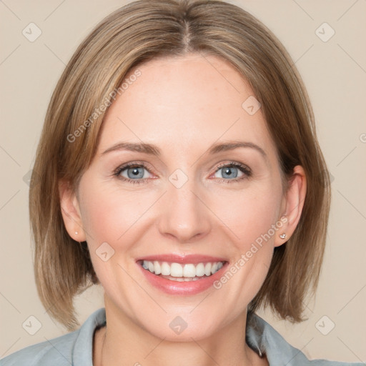 Joyful white adult female with medium  brown hair and blue eyes