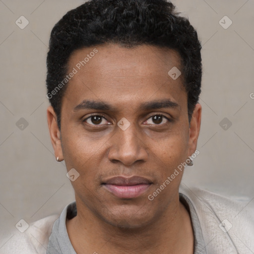 Joyful black young-adult male with short  black hair and brown eyes