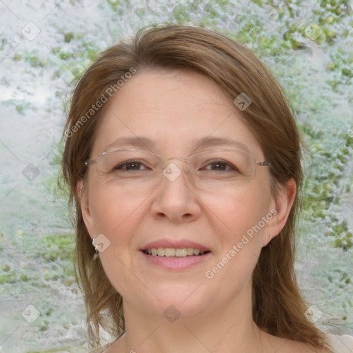 Joyful white adult female with medium  brown hair and blue eyes