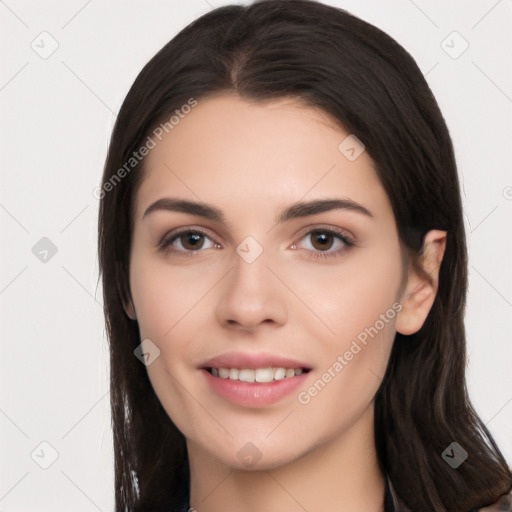 Joyful white young-adult female with long  black hair and brown eyes