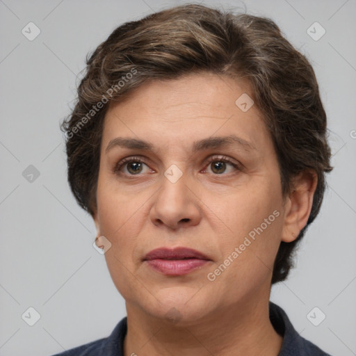 Joyful white adult female with short  brown hair and brown eyes