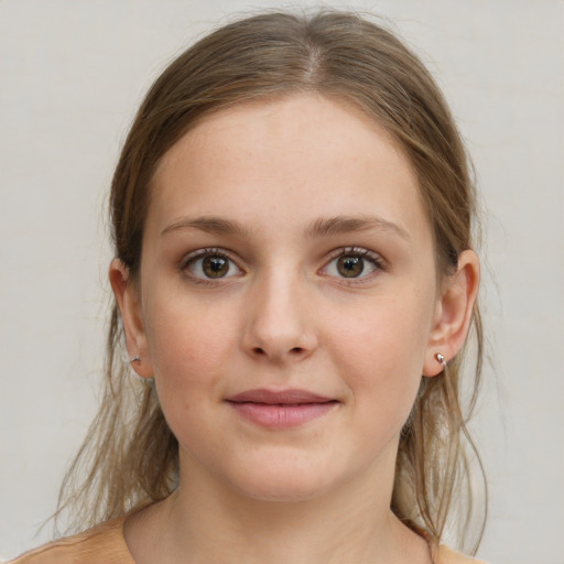 Joyful white young-adult female with medium  brown hair and blue eyes