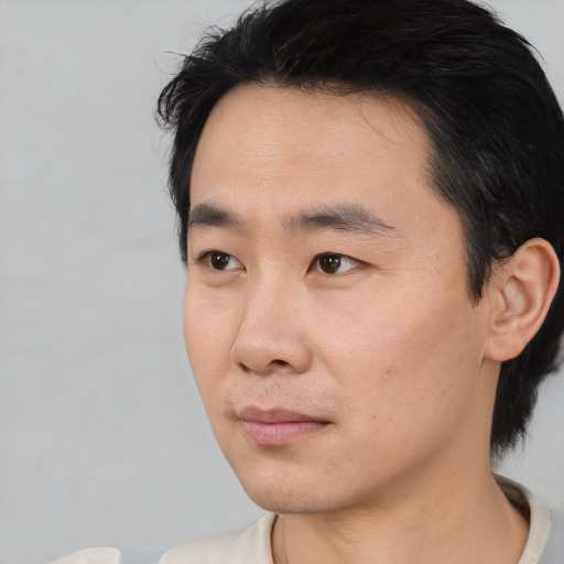 Neutral asian young-adult male with short  black hair and brown eyes