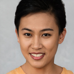 Joyful asian young-adult female with short  brown hair and brown eyes