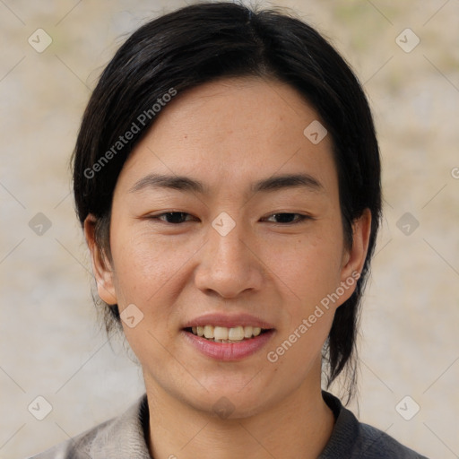 Joyful asian young-adult female with medium  black hair and brown eyes