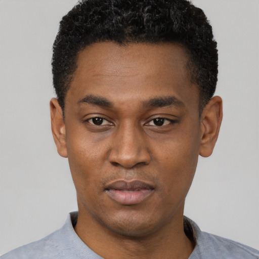 Neutral black young-adult male with short  black hair and brown eyes